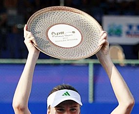 Daniela Hantuchova of Slovakia holds the trophy after winning her final match over Sara Errani of Italy in the PTT Pattaya Open tennis tournament in Pattaya, Sunday, Feb. 13. (AP Photo/Apichart Weerawong)
